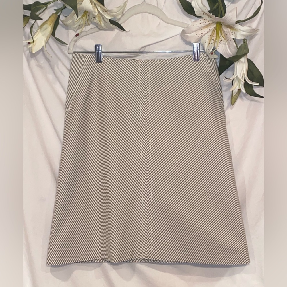 Banana Republic. Size 4. Above the knee cream and gray striped skirt.